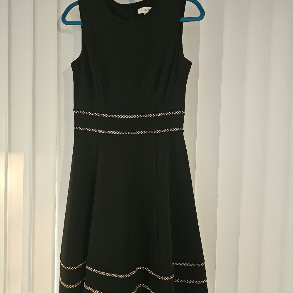 Chic Black Dress with Gold Accents